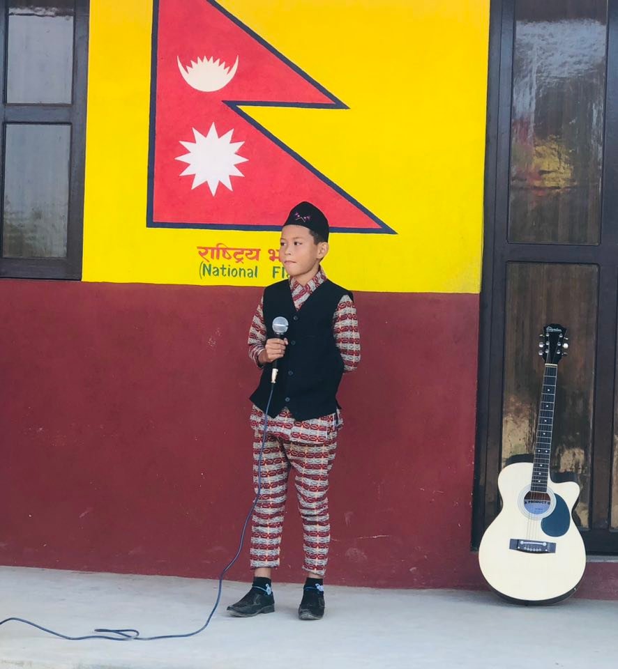 Students singing on stage